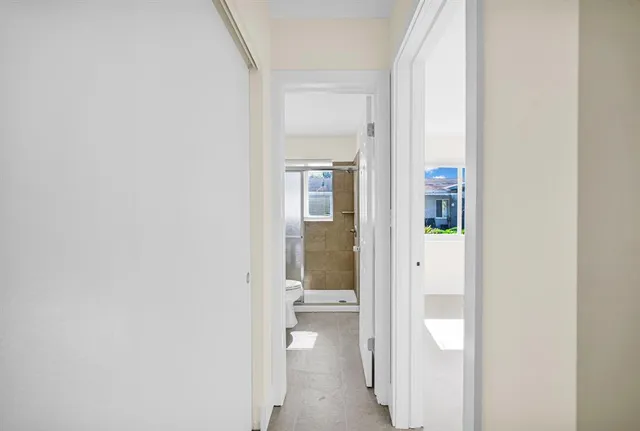 a view of a bathroom from a hallway