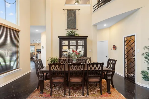 a view of a dining room with furniture and window