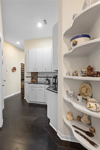 a kitchen with kitchen island stainless steel appliances a sink and stove