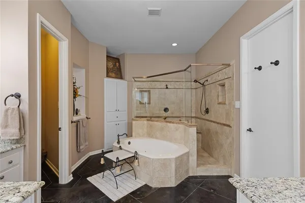 a bathroom with a sink a mirror and a shower