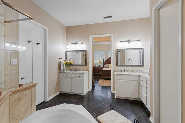 a room with a bed and a view of bathroom