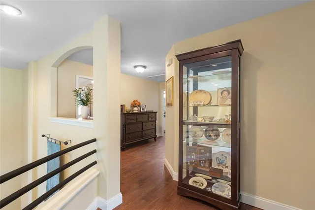 a view of an entryway with wooden floor