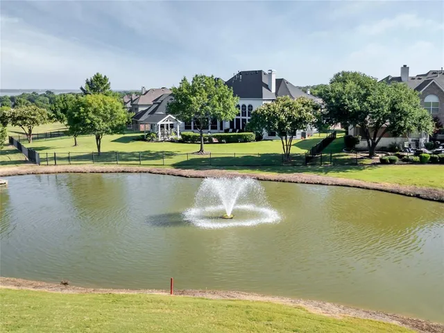 a view of a swimming pool and a yard