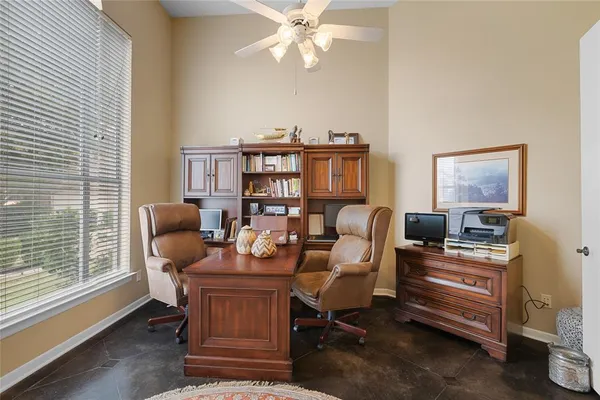 a work room with furniture and a window