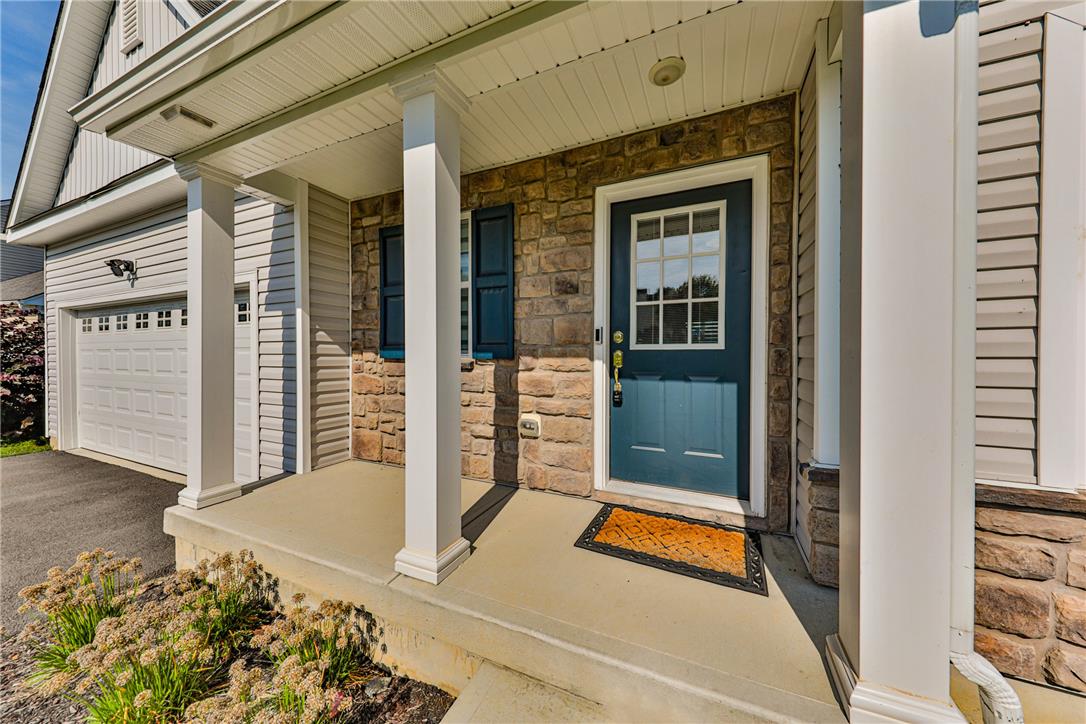 1105 Meco Road Easton, PA 18040 - Photo 6 of 100 Welcoming front porch entry highlights the striking stone veneer facade and classic support columns.