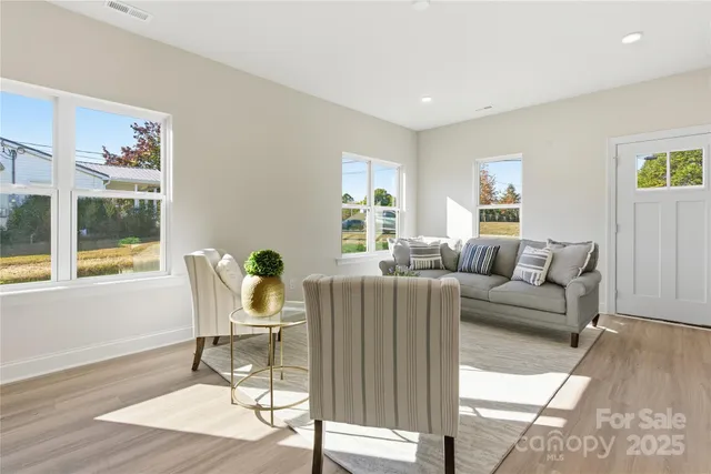 a living room with furniture and a table