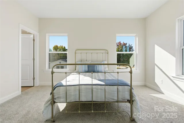 a bedroom with a bed and a table in it