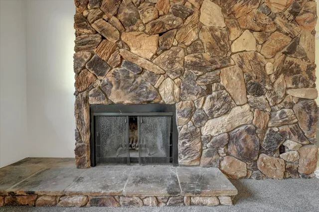 a kitchen with granite countertop a sink cabinets and stainless steel appliances