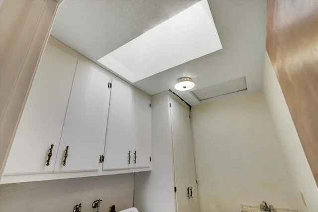 a view of a room with racks on the wall