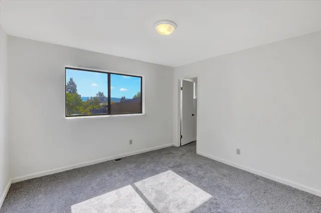 a view of a house with backyard