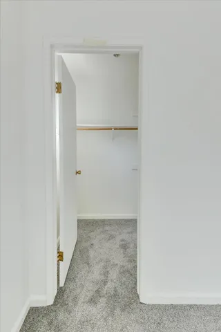 a view of a room that has a large window