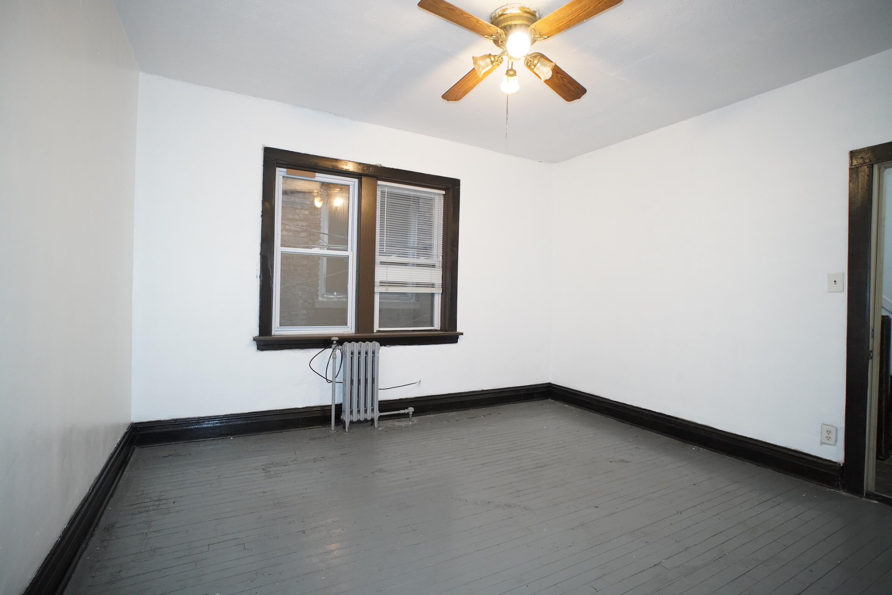 1166 Connecticut Street, Unit 6 Gary, IN 46407 - Photo 9 of 10 an empty room with windows