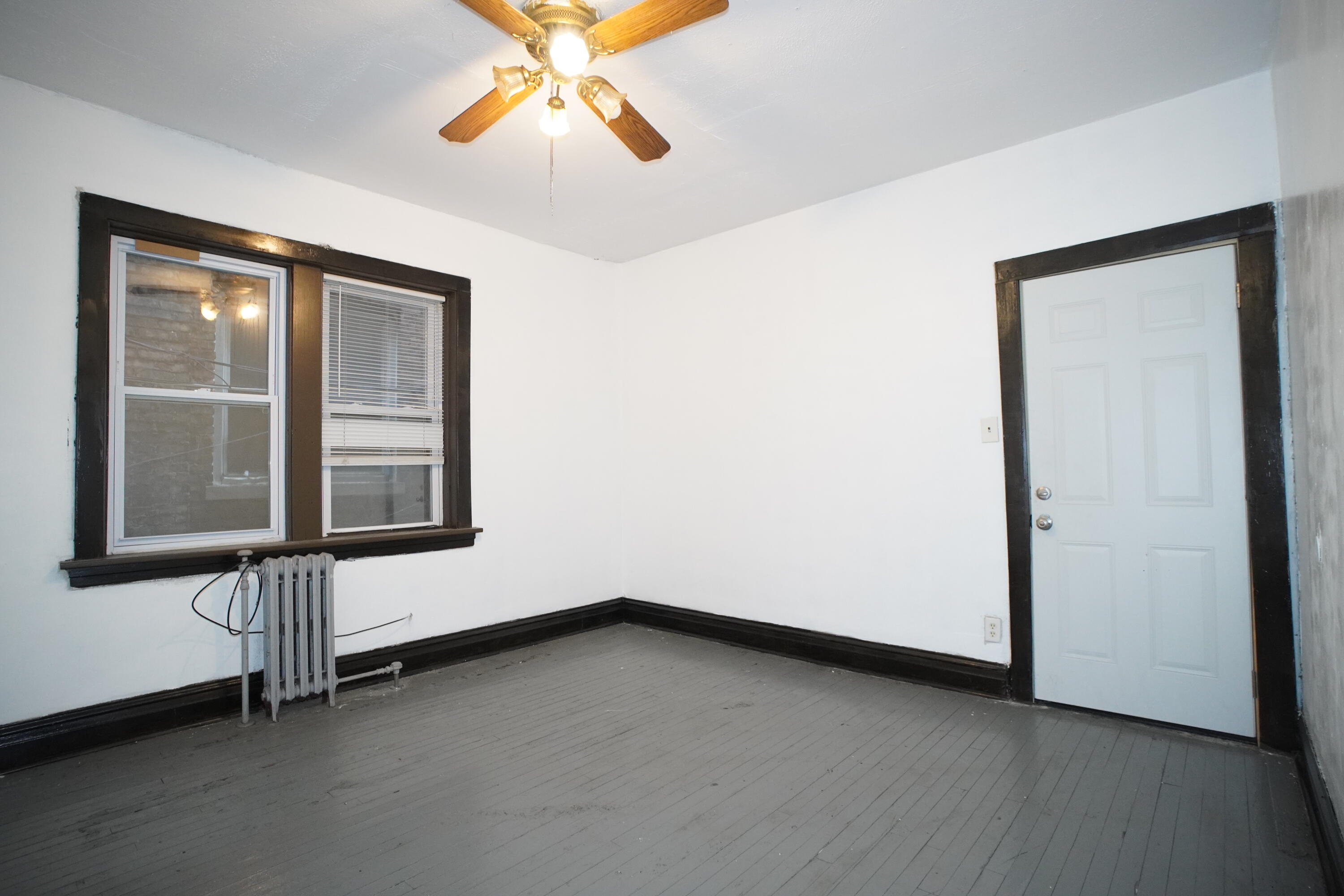 1166 Connecticut Street, Unit 6 Gary, IN 46407 - Photo 10 of 10 an empty room with a window