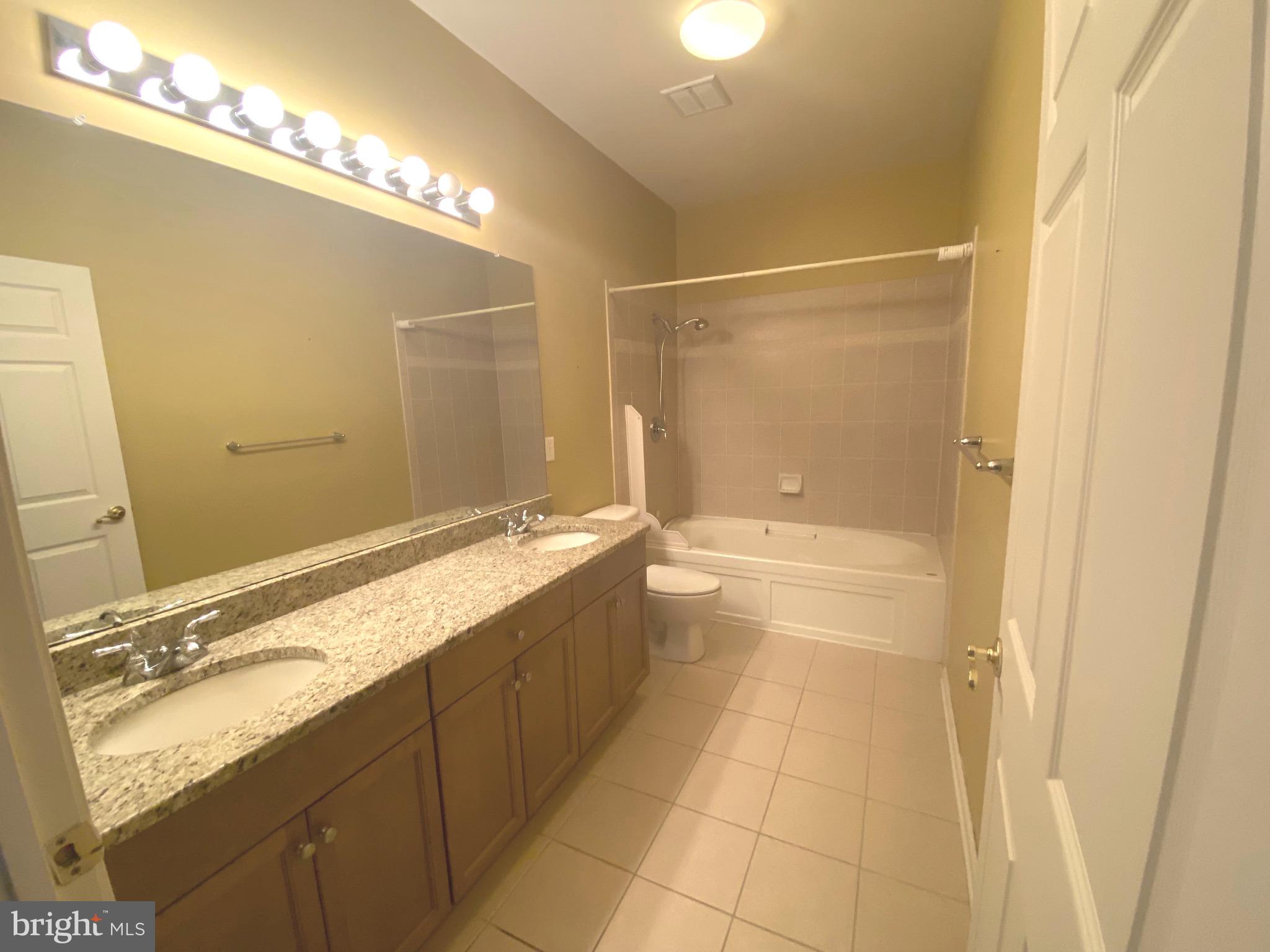 326 Masterson Court Ewing, NJ 08618 - Photo 8 of 17 a bathroom with a granite countertop sink a toilet and shower