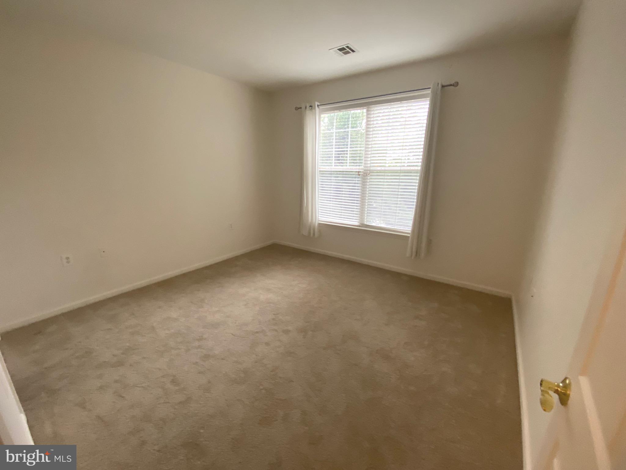 326 Masterson Court Ewing, NJ 08618 - Photo 9 of 17 an empty room with a window