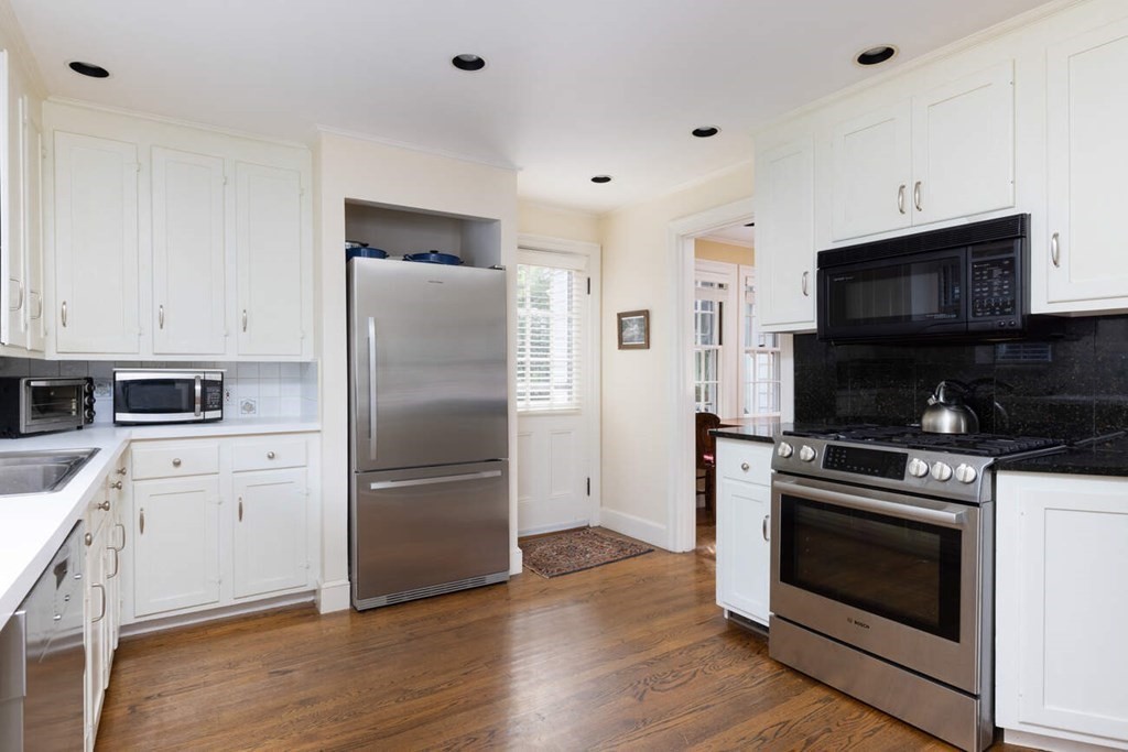 54 Bound Brook Road Newton, MA 02461 - Photo 5 of 14 a kitchen with a stove microwave and refrigerator