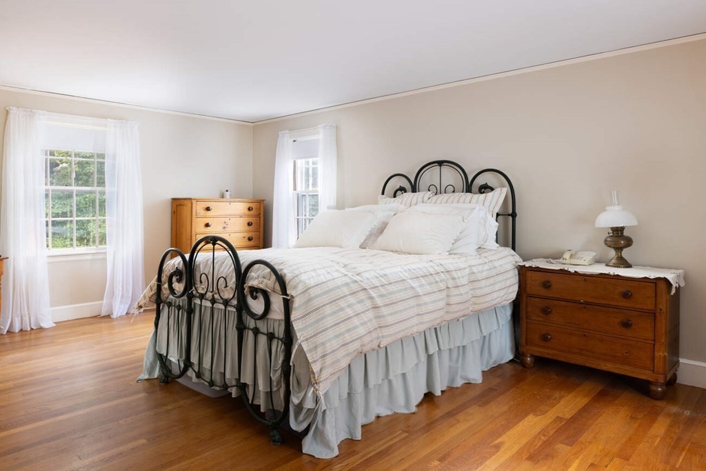 54 Bound Brook Road Newton, MA 02461 - Photo 9 of 14 a bedroom with a bed and wooden floor