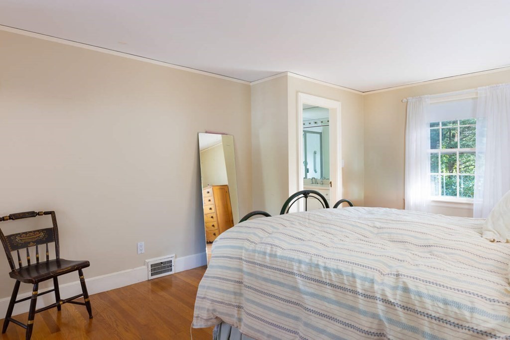 54 Bound Brook Road Newton, MA 02461 - Photo 10 of 14 a bedroom with a bed and a window