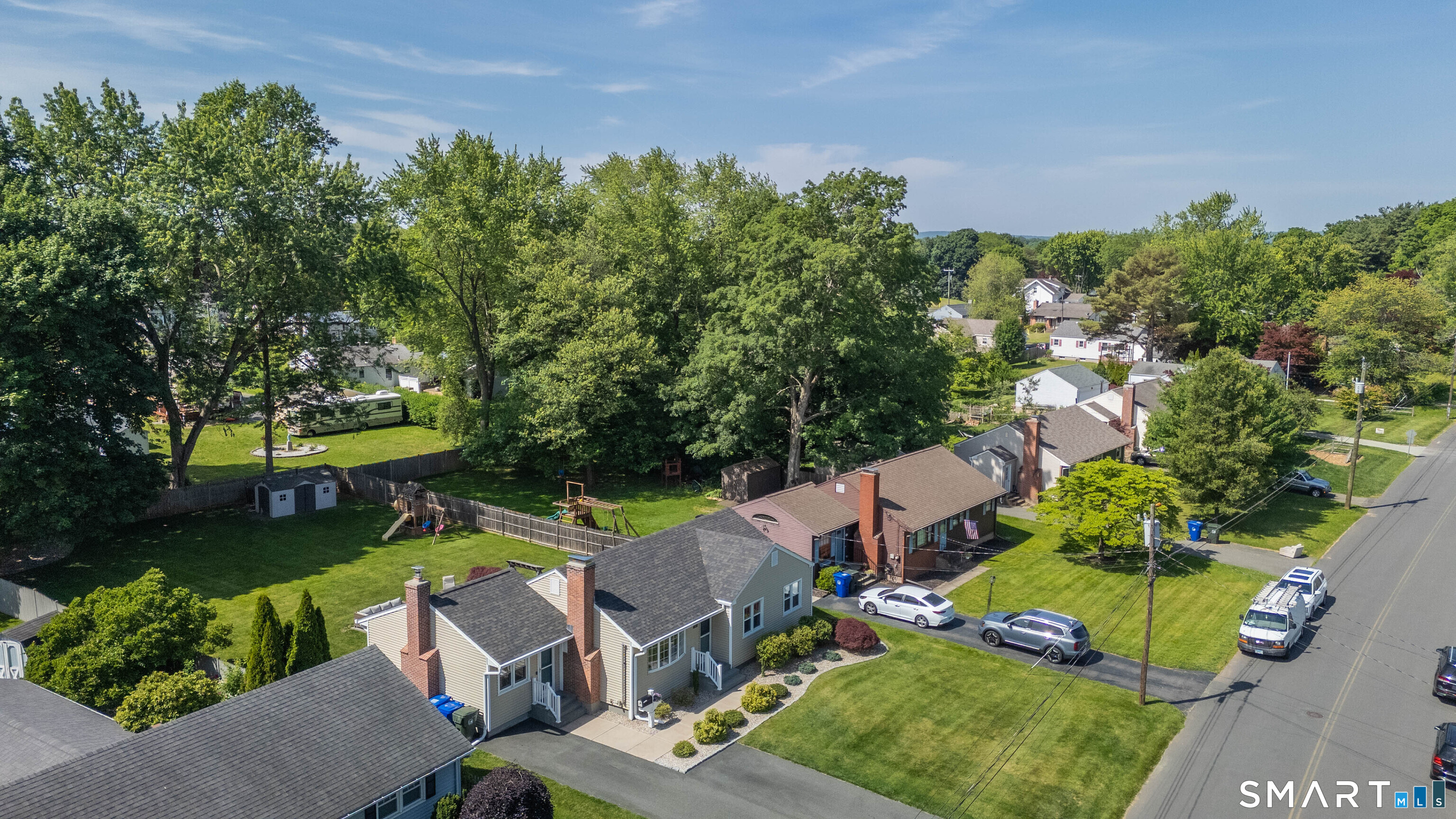 87 Lydall Road Newington, CT 06111 - Photo 32 of 35 an aerial view of a house with a garden and swimming pool