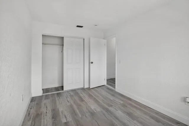 a view of room with hardwood floor
