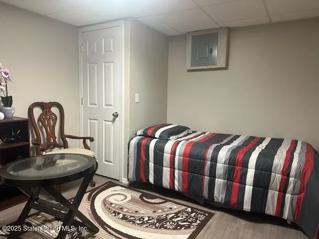 a bedroom with a bed and chair