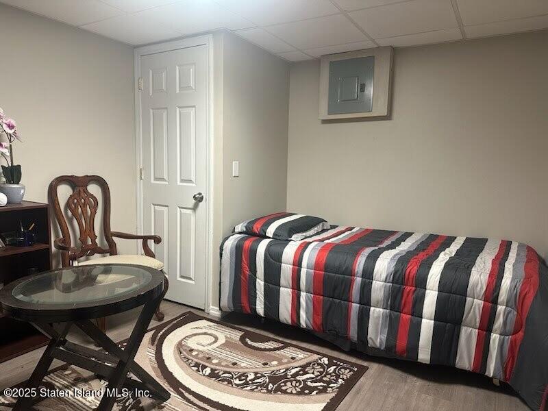 12 Delmar Avenue, Unit A Staten Island, NY 10312 - Photo 12 of 19 a bedroom with a bed and chair