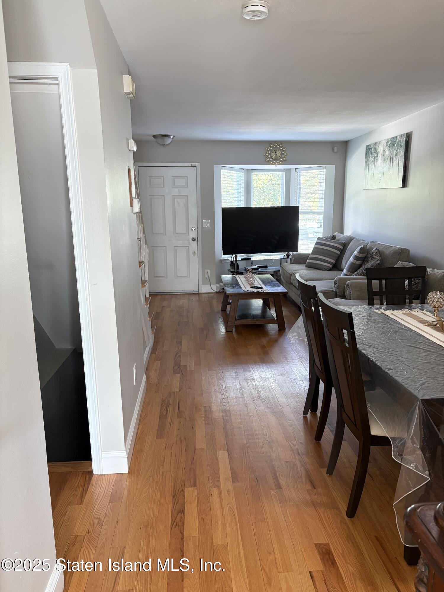 12 Delmar Avenue, Unit A Staten Island, NY 10312 - Photo 6 of 19 a living room with furniture and a flat screen tv