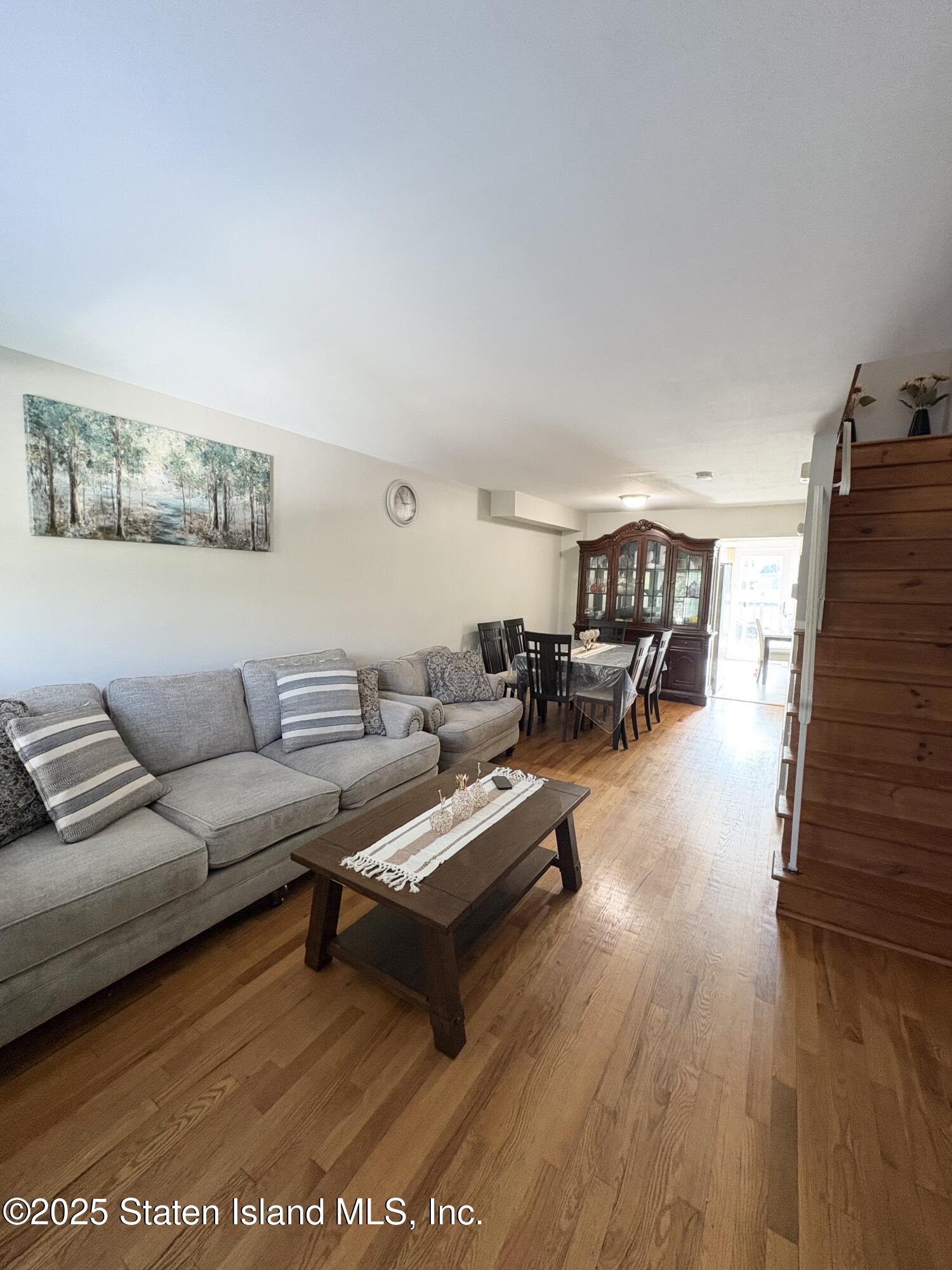 12 Delmar Avenue, Unit A Staten Island, NY 10312 - Photo 7 of 19 a living room with furniture and a wooden floor