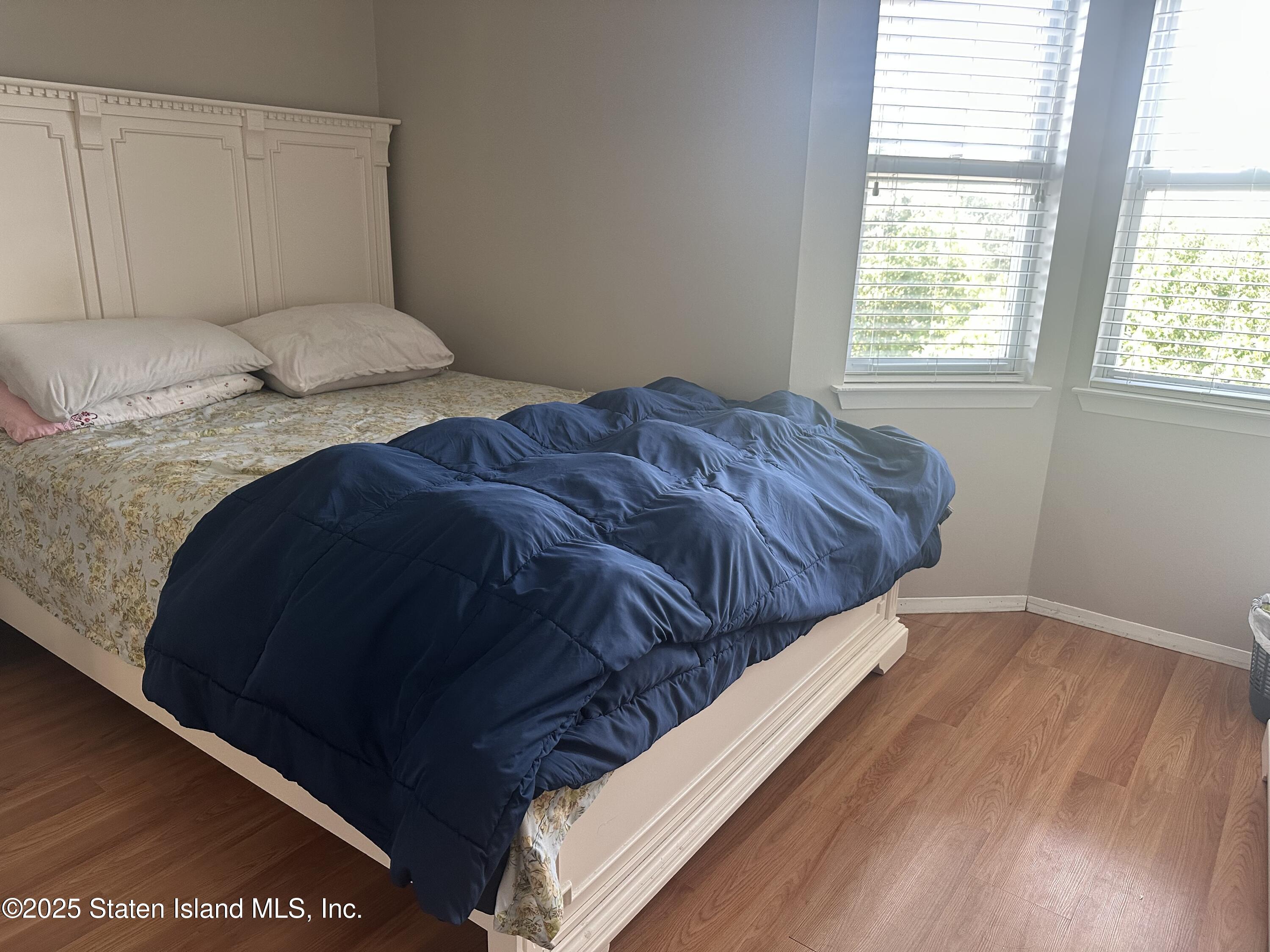 12 Delmar Avenue, Unit A Staten Island, NY 10312 - Photo 9 of 19 a bedroom with a bed and window