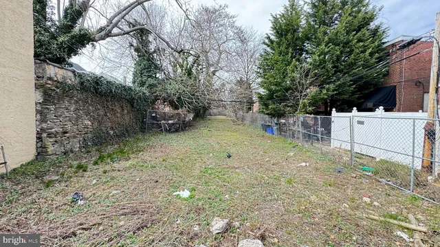 a view of a backyard with a trees