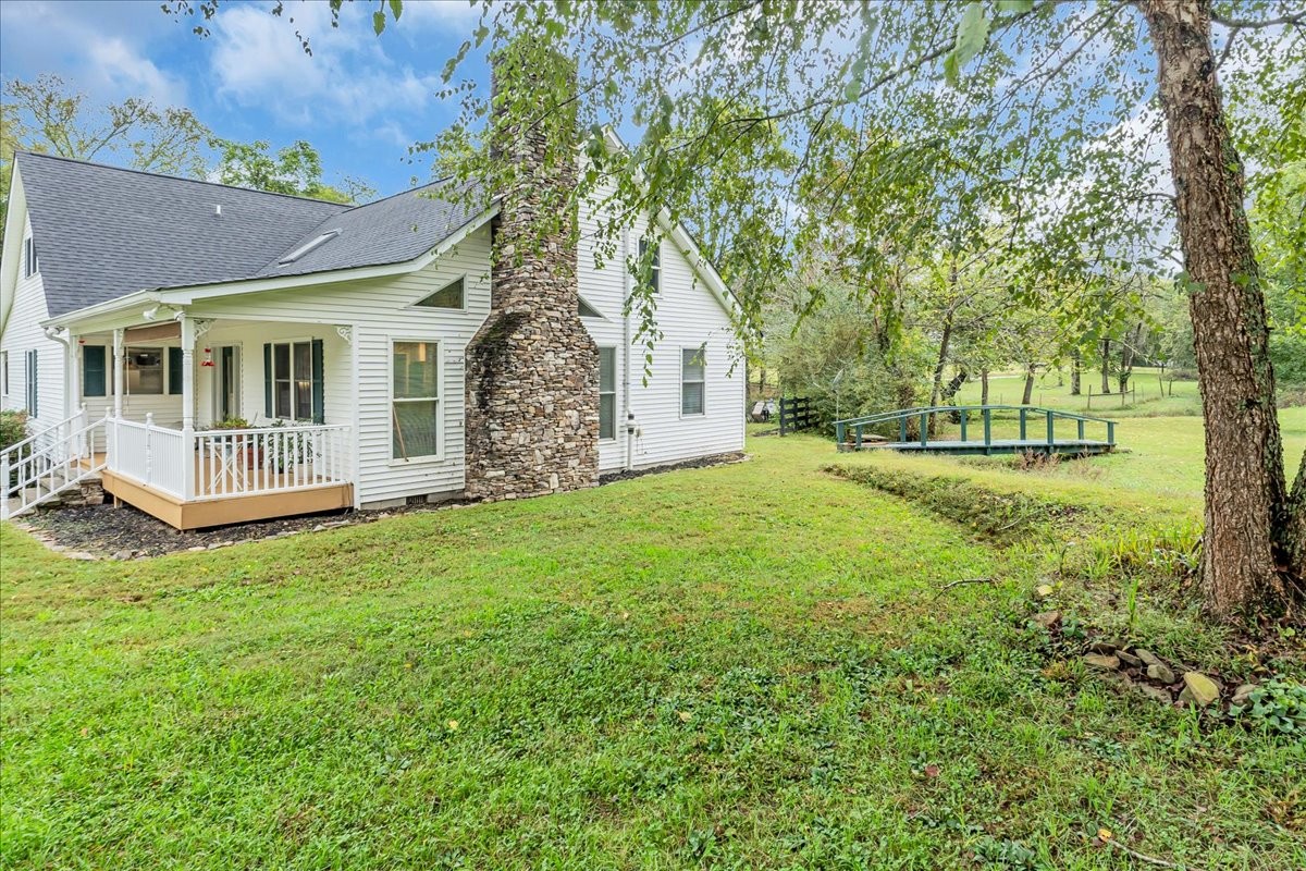 830 Bobo Hollow Road Lynchburg, TN 37352 - Photo 19 of 71 a view of a yard in front of a house with large trees