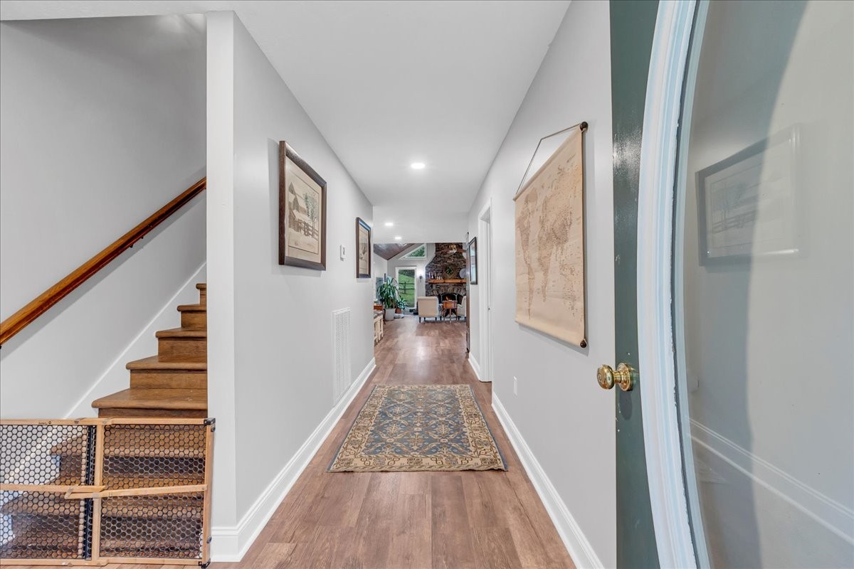 830 Bobo Hollow Road Lynchburg, TN 37352 - Photo 25 of 71 a view of a hallway with wooden floor and staircase
