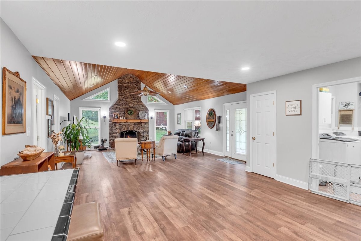 830 Bobo Hollow Road Lynchburg, TN 37352 - Photo 27 of 71 a living room with furniture and a wooden floor