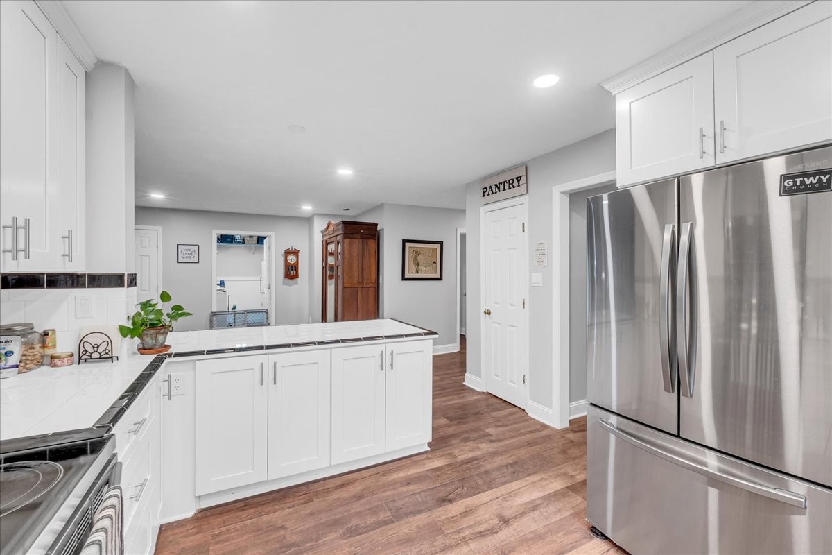 830 Bobo Hollow Road Lynchburg, TN 37352 - Photo 34 of 71 a kitchen with stainless steel appliances a refrigerator and a stove top oven