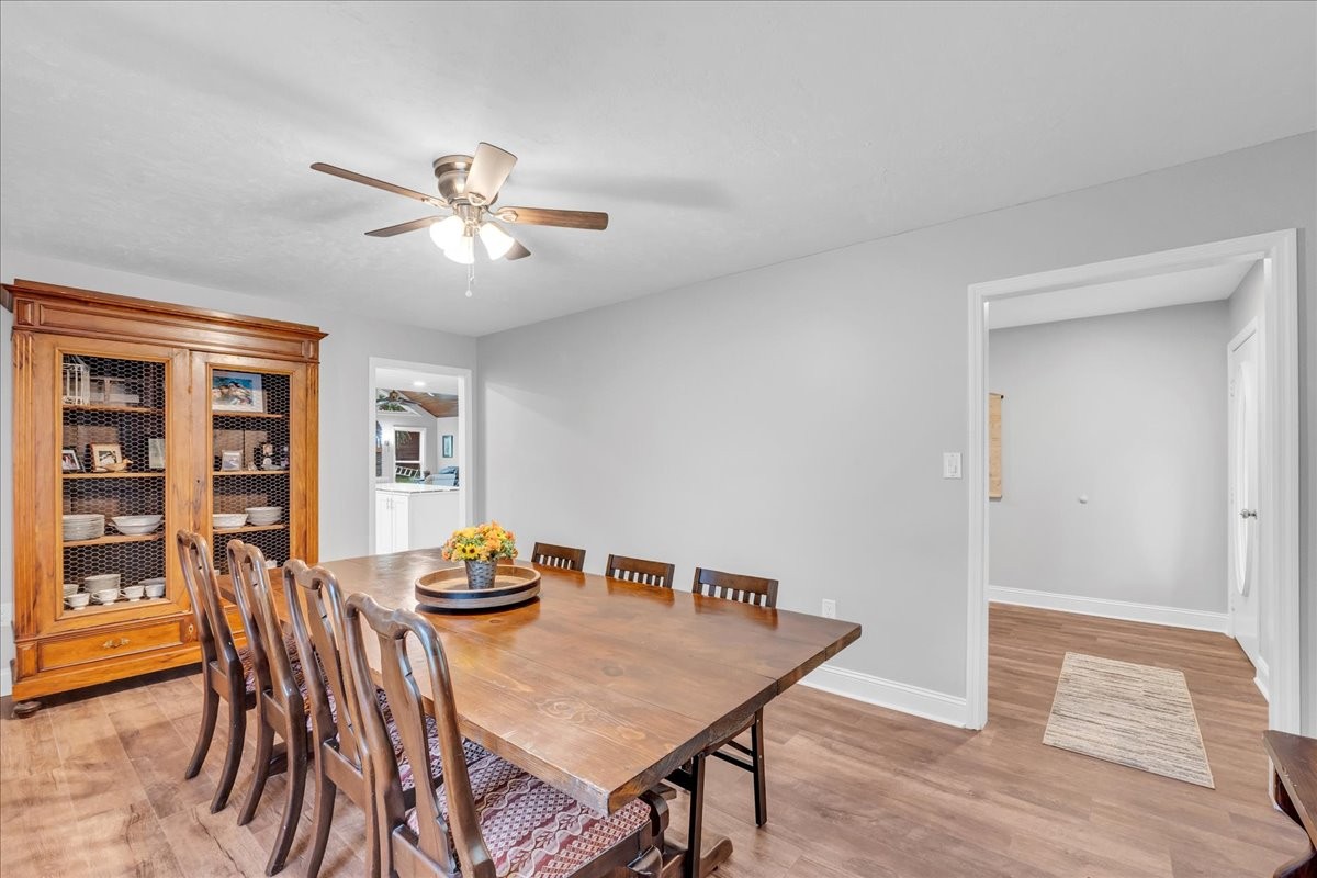 830 Bobo Hollow Road Lynchburg, TN 37352 - Photo 36 of 71 a view of a dining room with furniture and wooden floor