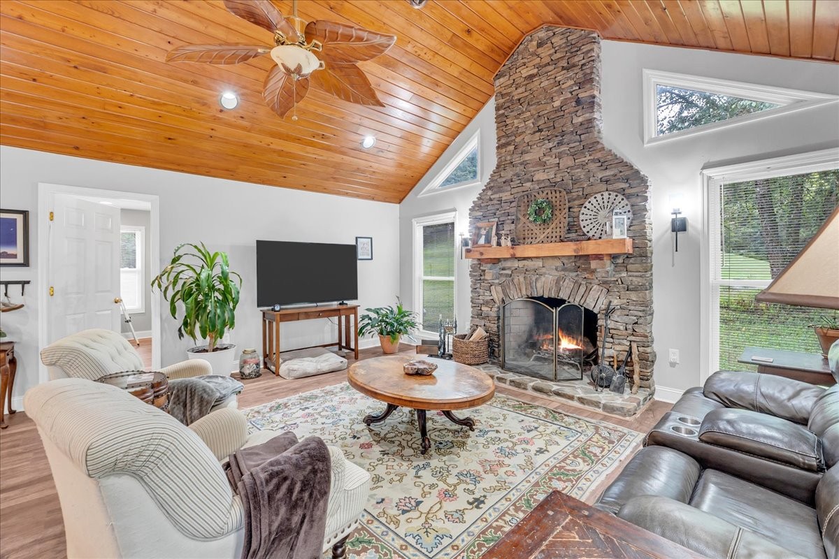 830 Bobo Hollow Road Lynchburg, TN 37352 - Photo 41 of 71 a living room with furniture a window and a fireplace