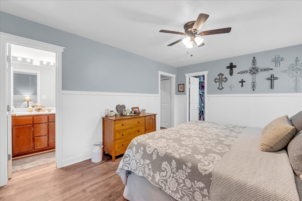 830 Bobo Hollow Road Lynchburg, TN 37352 - Photo 50 of 71 a bedroom with a bed and a dresser