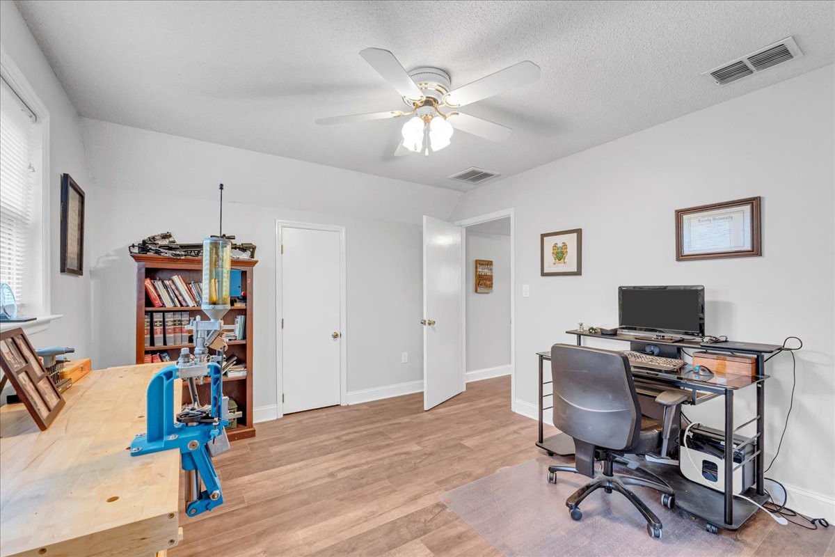 830 Bobo Hollow Road Lynchburg, TN 37352 - Photo 53 of 71 a view of a workspace with furniture and a ceiling fan