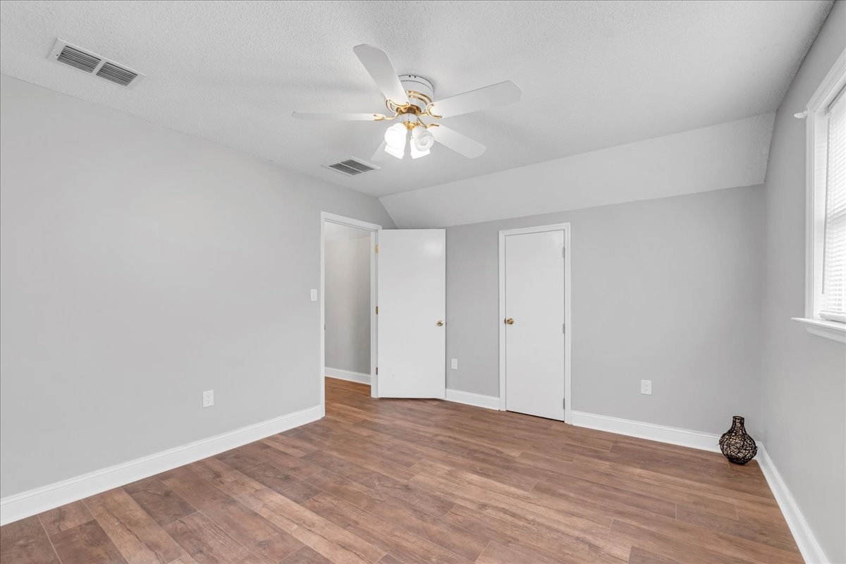830 Bobo Hollow Road Lynchburg, TN 37352 - Photo 57 of 71 a view of an empty room with wooden floor and a window