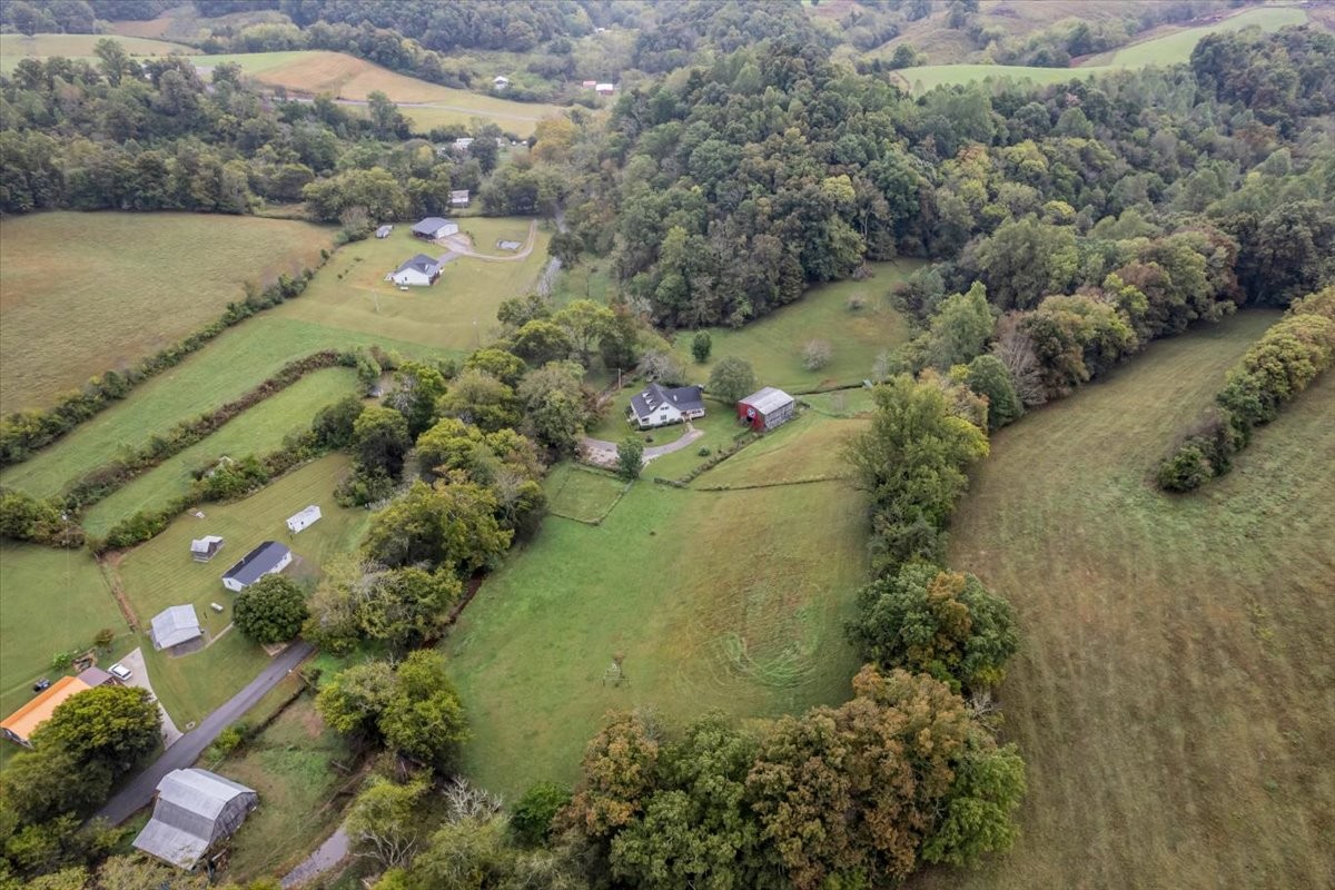 830 Bobo Hollow Road Lynchburg, TN 37352 - Photo 68 of 71 a aerial view of a house with a yard and lake view