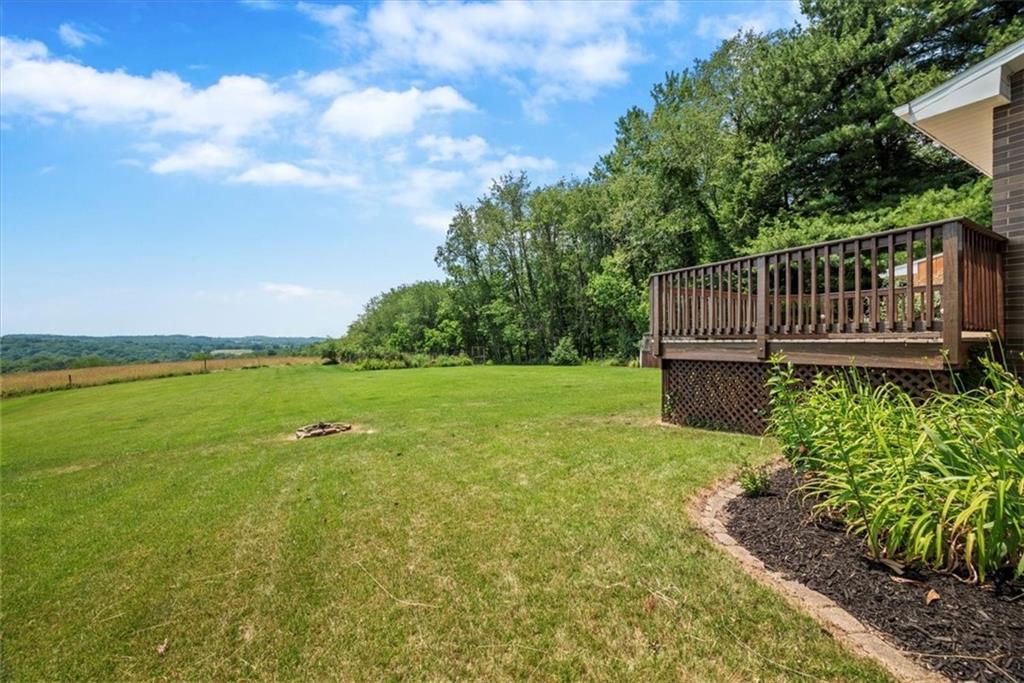 138 Stepp Road Sarver, PA 16055 - Photo 42 of 46 a view of a deck with a big yard potted plants and large tree