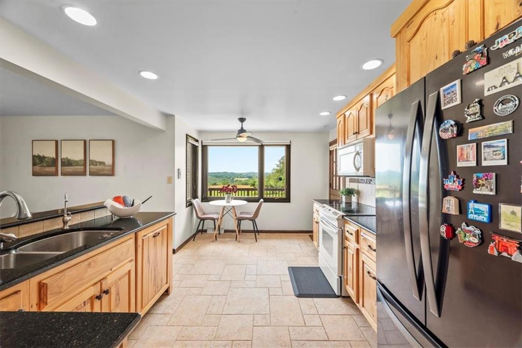 138 Stepp Road Sarver, PA 16055 - Photo 10 of 46 a kitchen with stainless steel appliances granite countertop a sink and a refrigerator