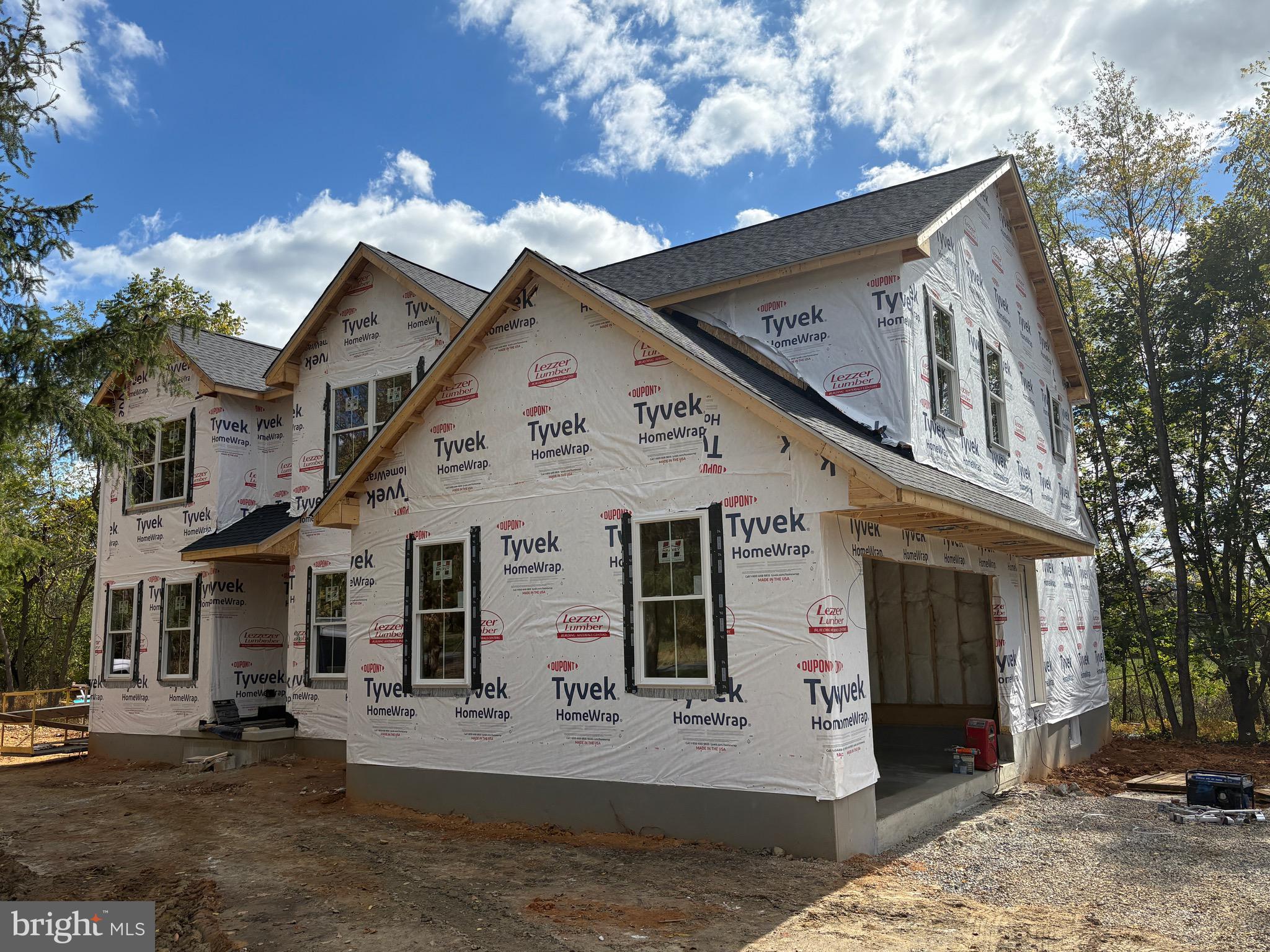 a front view of a house with parking space