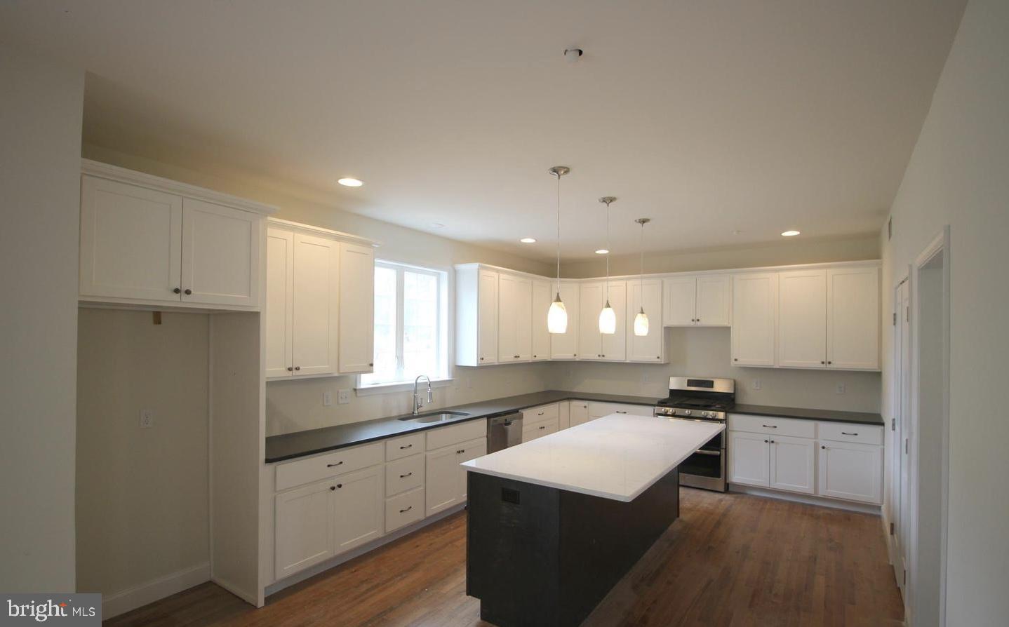 220 Fairview Road Glenmoore, PA 19343 - Photo 7 of 14 a kitchen with a sink window and cabinets
