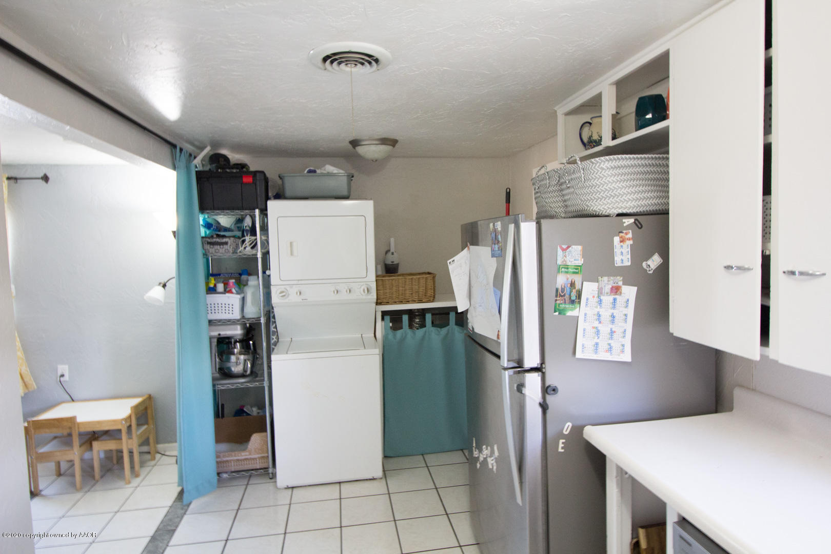 313 Southwest 38th Avenue Amarillo, TX 79110 - Photo 12 of 22 a kitchen with stainless steel appliances a refrigerator and a cabinets