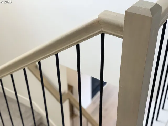 a view of staircase with rug floor and window