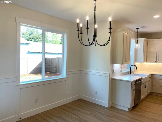 a bathroom with a double vanity sink and a window