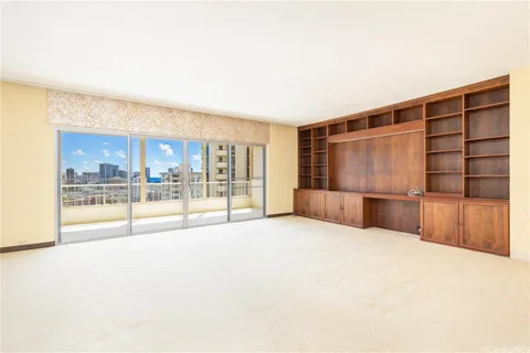a view of an empty room with a cabinet