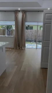 a view of empty room with floor to ceiling window