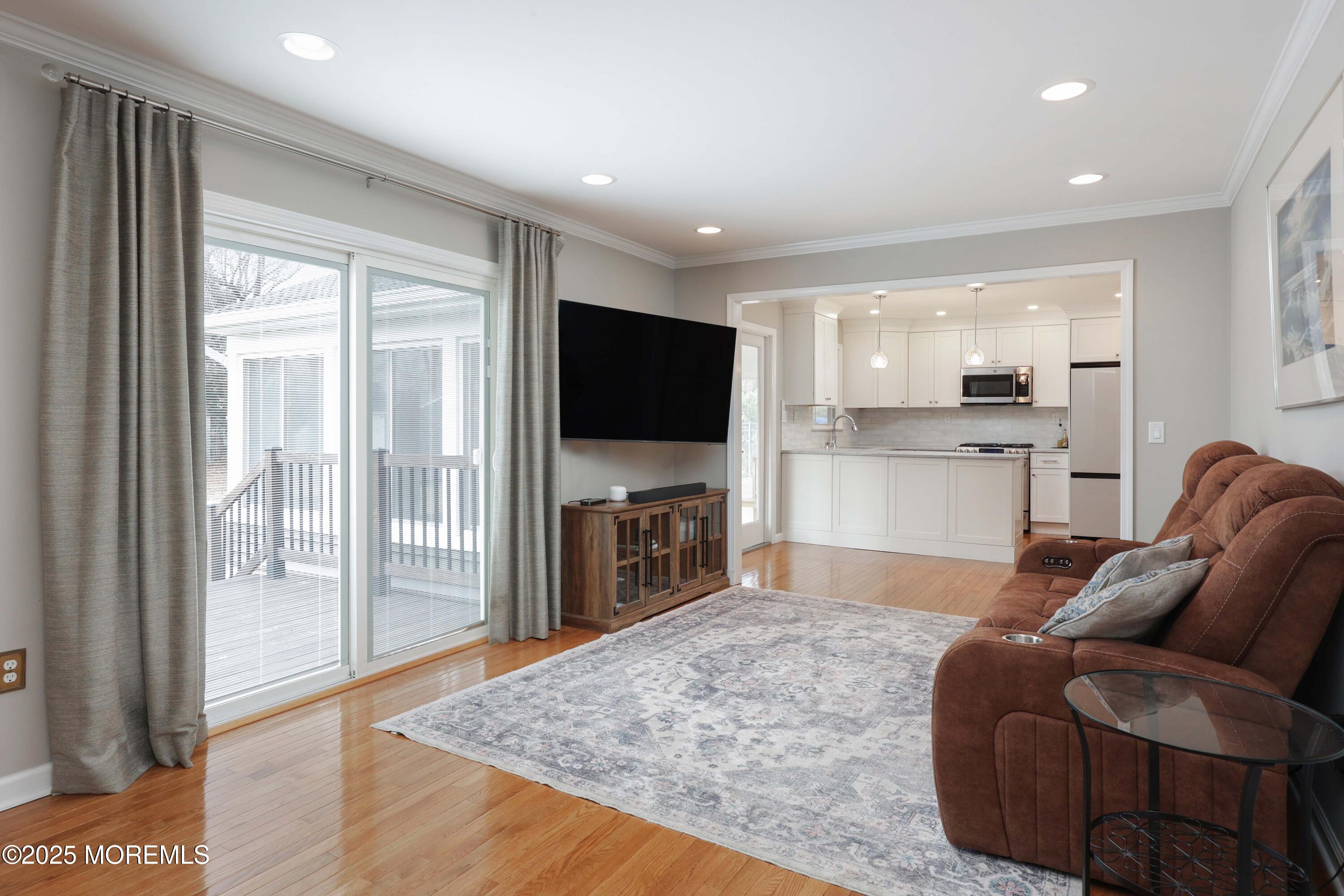 6 Hawthorne Road Red Bank, NJ 07701 - Photo 17 of 40 a living room with fireplace furniture and a flat screen tv